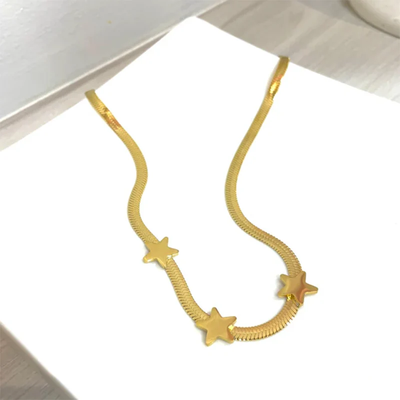 Astrivyn gold-tone Star Necklace on a jewellery display